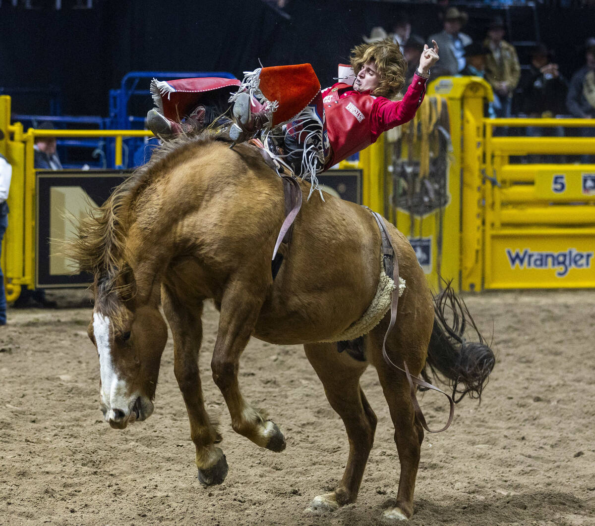 Bareback riding contestant Rocker Steiner rides Tator Tot to a winning score during National Fi ...