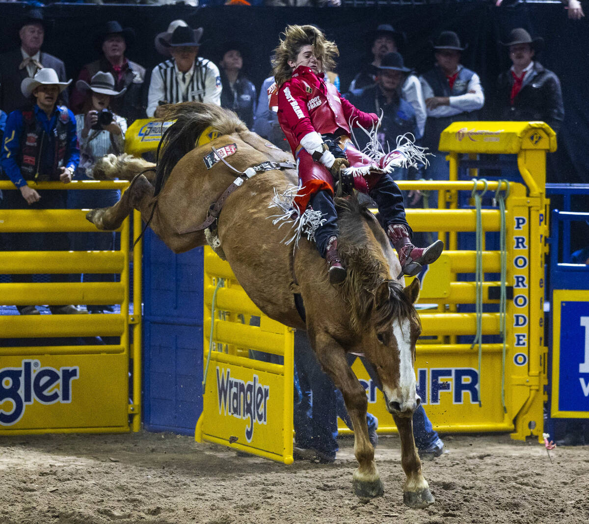 Bareback riding contestant Rocker Steiner rides Tator Tot to a winning score during National Fi ...