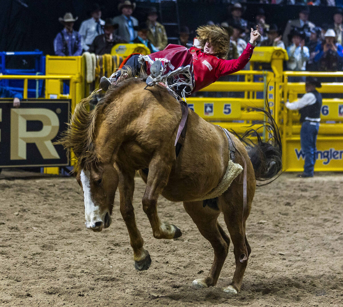 Bareback riding contestant Rocker Steiner rides Tator Tot to a winning score during National Fi ...