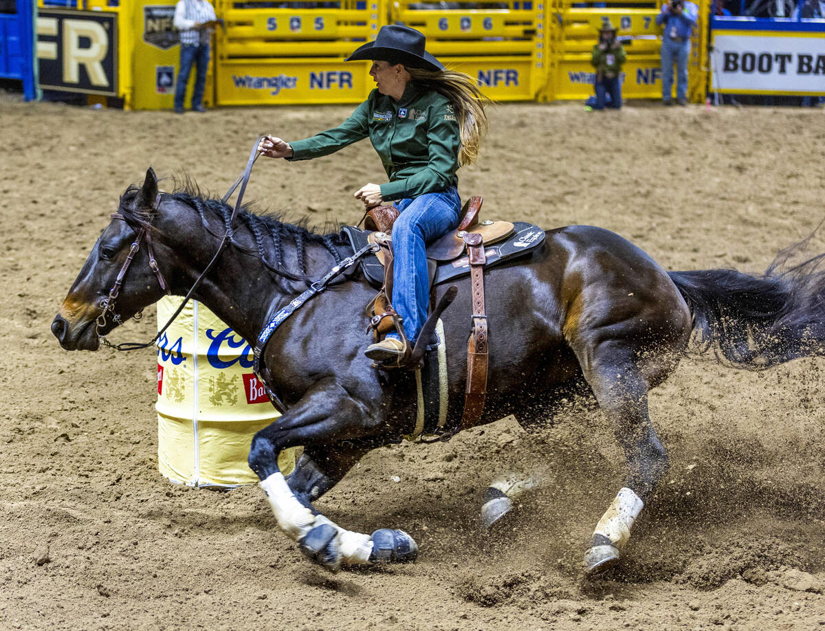 Barrel Racing contestant Kassie Mowry rides to a new event time record during National Finals R ...