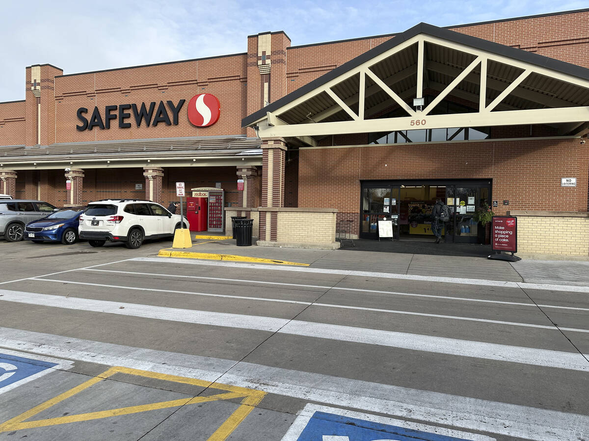 A shopper heads into a Safeway store, which is part of the Albertson's grocery chain, Tuesday, ...