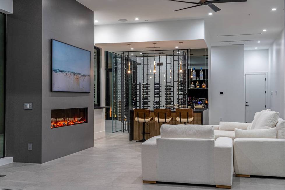 A sitting area features a modern fireplace. (Theo Ayala/The Agency Las Vegas)