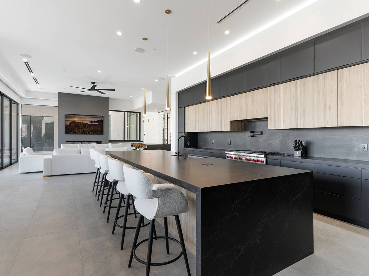 Alejandra Morea’s sleek two-tone kitchen design boasts custom black matte and Taction Oak cab ...