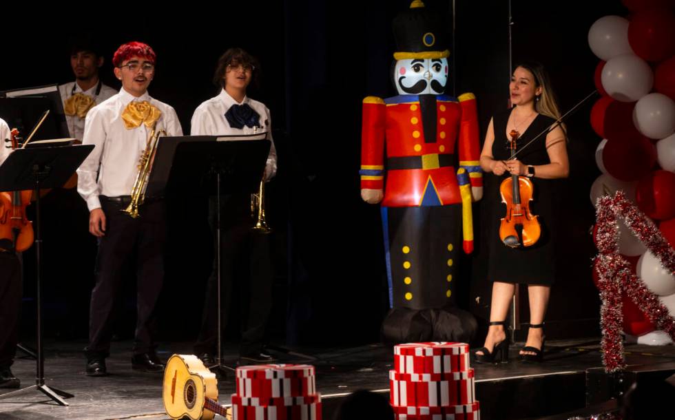 Elizabeth Mendez, director of the mariachi program at Cheyenne High School, right, looks on dur ...