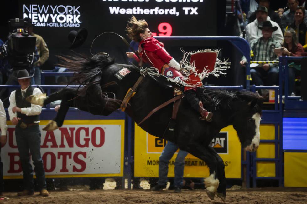 Rocker Steiner competes in bareback riding during the 8th go-round of the National Finals Rodeo ...