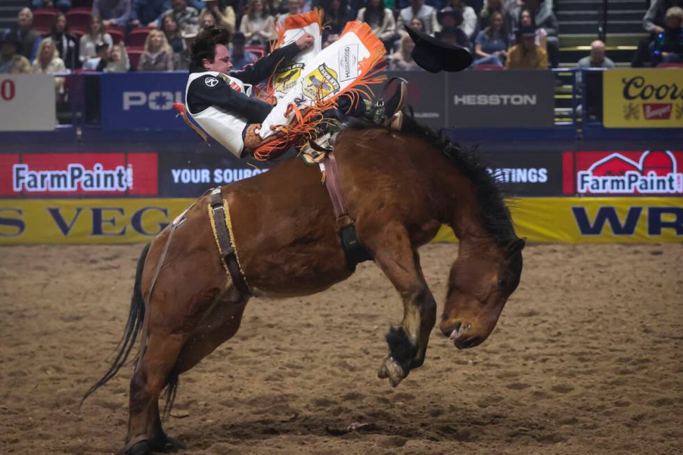 Cole Reiner competes in bareback riding during the 8th go-round of the National Finals Rodeo at ...