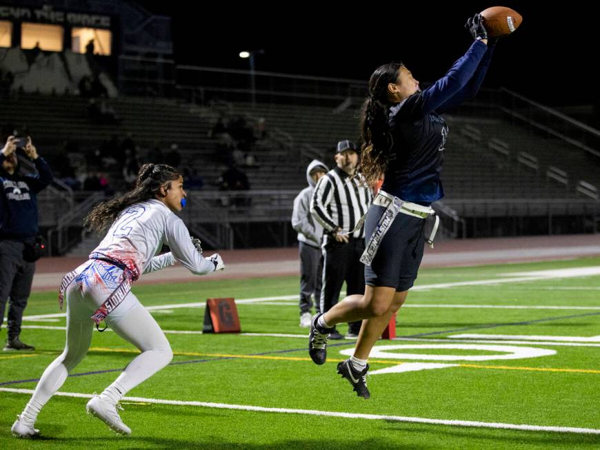 Shadow Ridge junior Jaylani Palmer (12) catches a pass in the end zone during the high school f ...