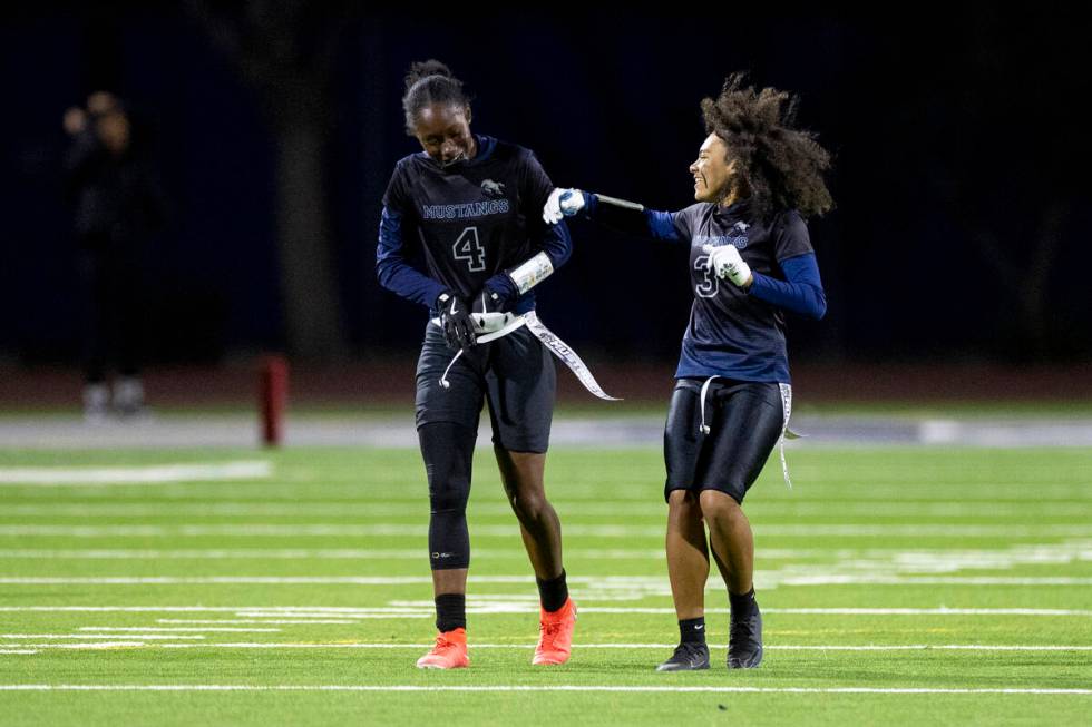 Shadow Ridge senior Tyriel Cole (4) and sophomore Claudia Parker (3) laugh during the high scho ...