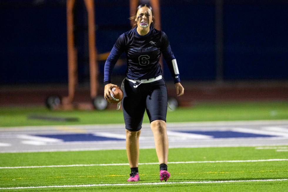 Shadow Ridge sophomore Chloe Covington (6) celebrates after scoring a touchdown during the high ...