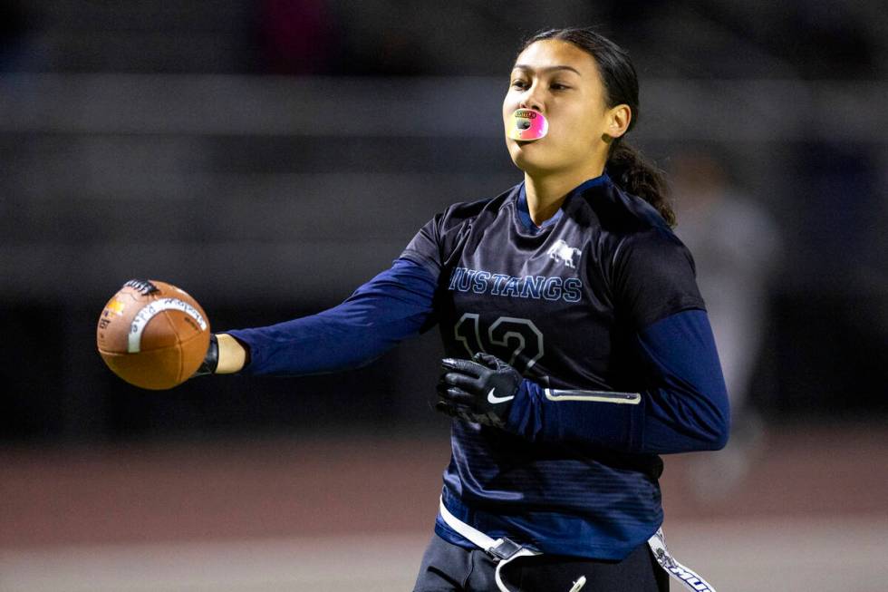 Shadow Ridge junior Jaylani Palmer (12) reaches out to score a touchdown during the high school ...