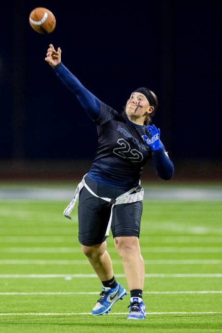 Shadow Ridge senior Aubree Davis (22) throws the ball during the high school flag football game ...