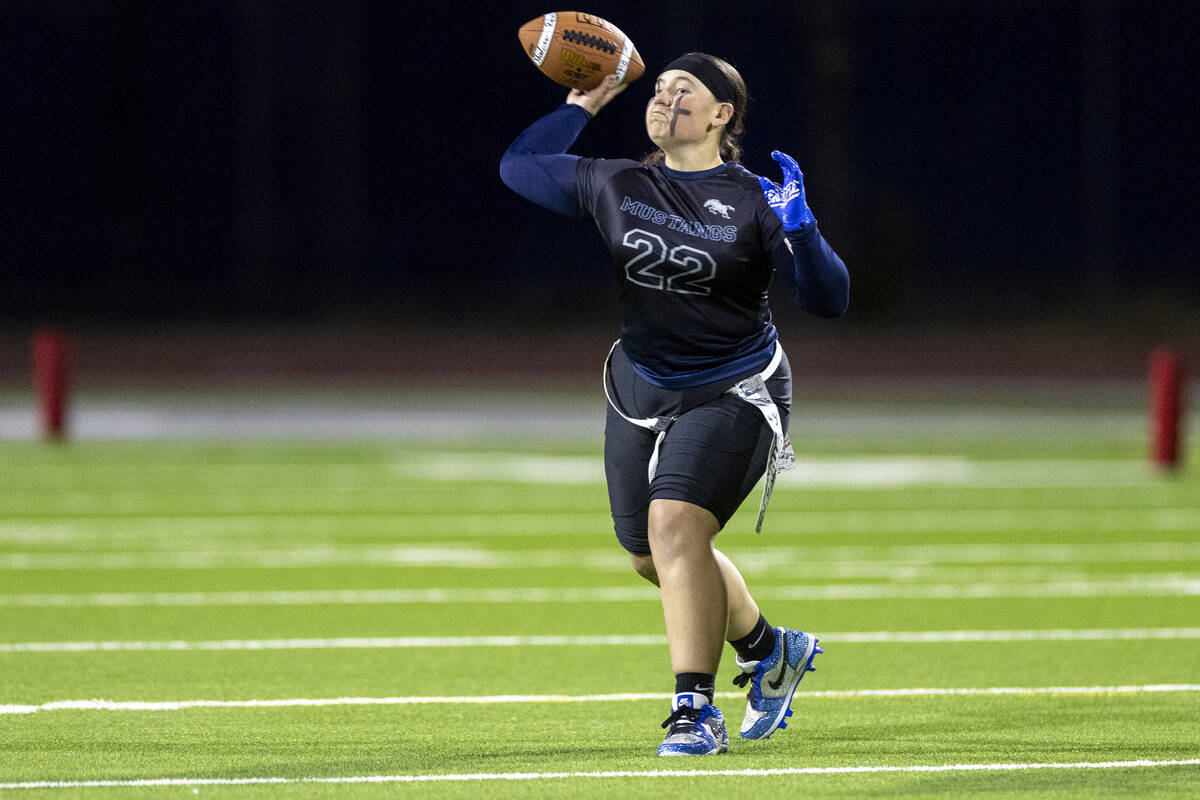 Shadow Ridge senior Aubree Davis (22) looks to throw the ball during the high school flag footb ...