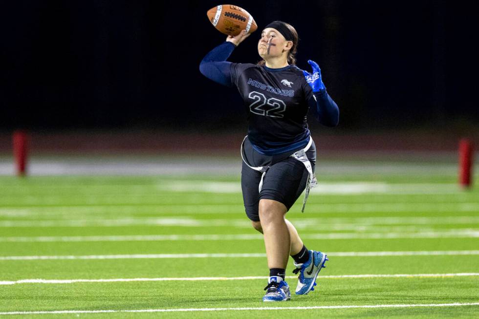 Shadow Ridge senior Aubree Davis (22) looks to throw the ball during the high school flag footb ...