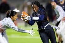 Shadow Ridge senior Savanna McDow, right, avoids Liberty defenders during the high school flag ...