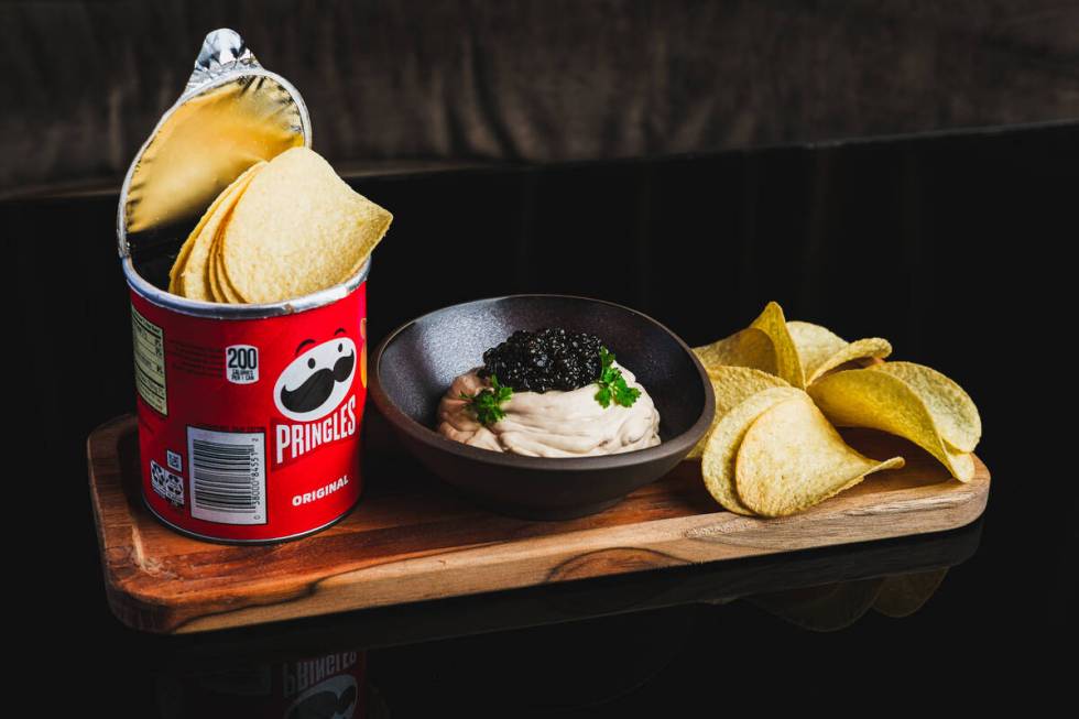 Caspian's Cocktails & Caviar's chips and dip -- Pringles and caviar -- are shown in this public ...