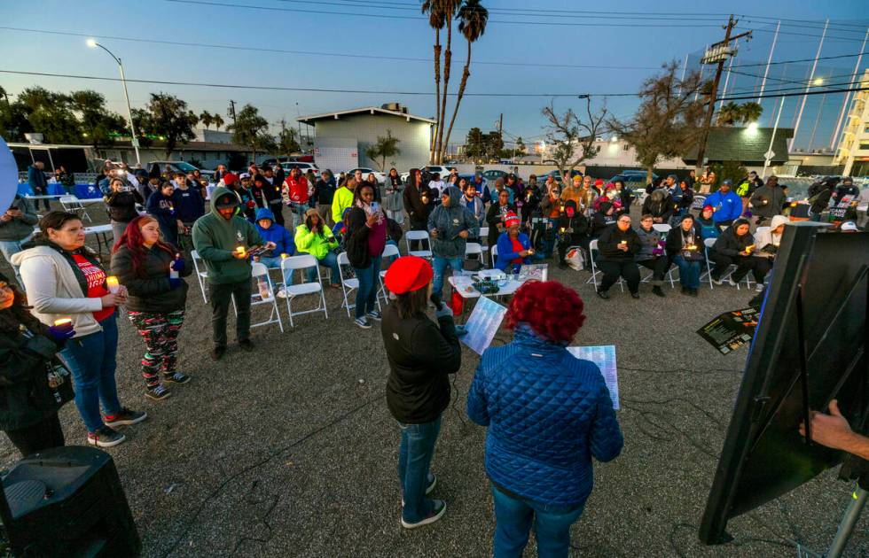 Attendees hold their lit candles as the names of those lost this year a read during the 31st Ho ...