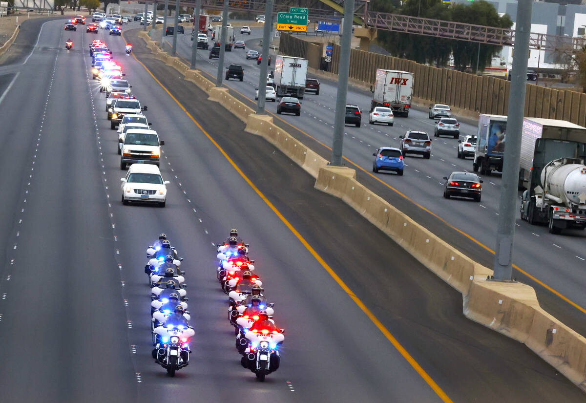 A hearse carrying the casket of Metropolitan Police officer Colton Pulsipher, who died in a cra ...