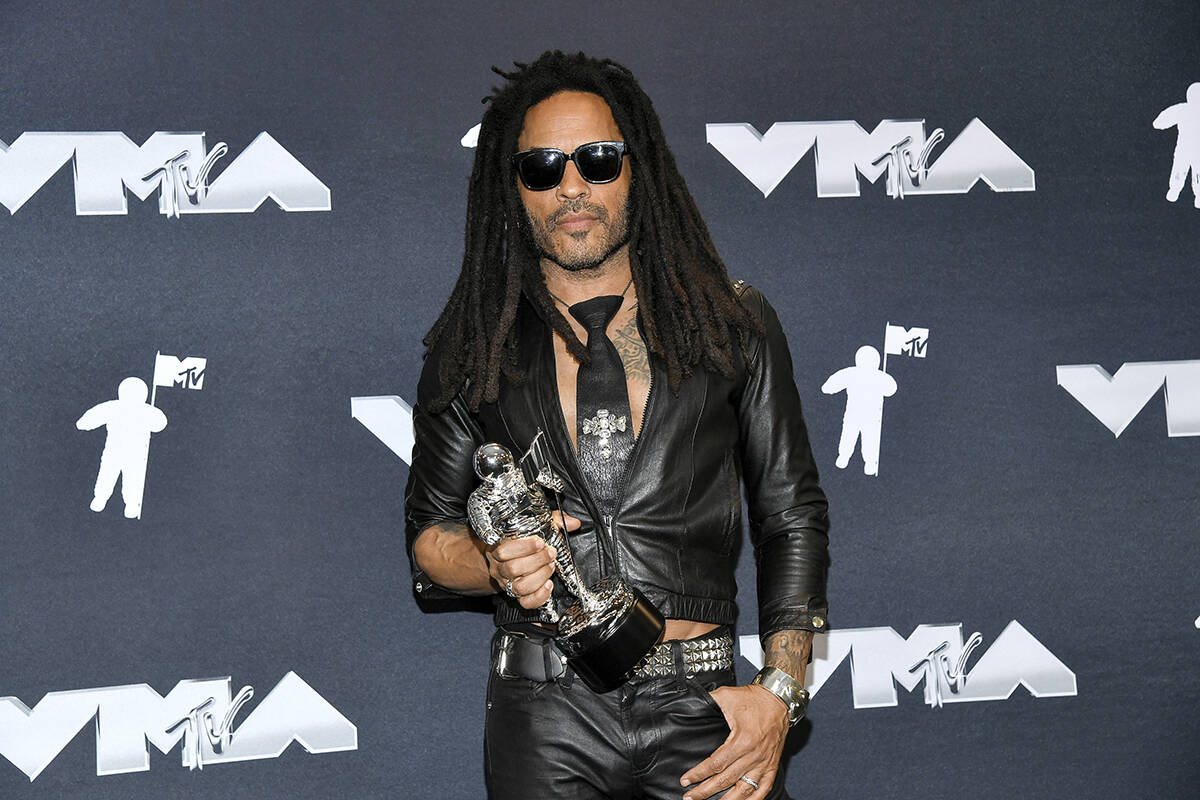 Lenny Kravitz poses in the press room during the MTV Video Music Awards on Wednesday, Sept. 11, ...