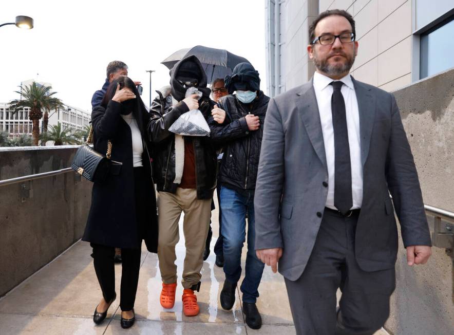 Alexander Smirnov, second left, leaves the Lloyd George U.S. Courthouse with his attorneys, Dav ...