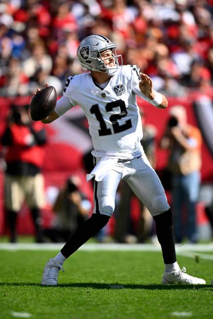 Las Vegas Raiders quarterback Aidan O'Connell (12) throws a pass against the Tampa Bay Buccanee ...