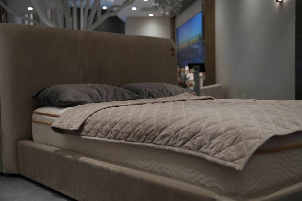 Weighted blankets on display in a Saatva mattress showroom in New York, Dec. 4, 2024. (AP Photo ...