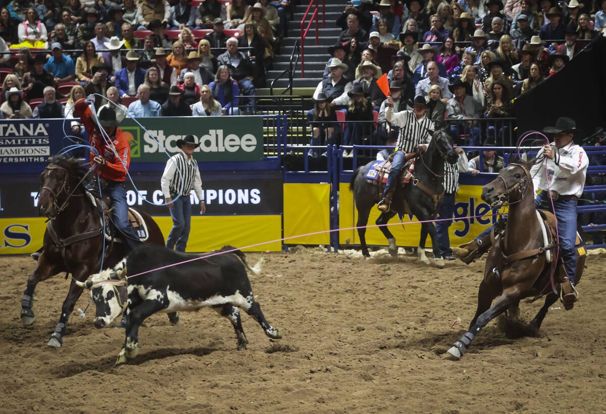 Clay Smith and Coleby Payne compete in team roping during the 8th go-round of the National Fina ...