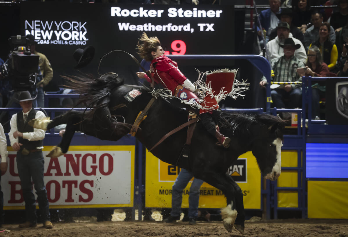 Rocker Steiner competes in bareback riding during the 8th go-round of the National Finals Rodeo ...