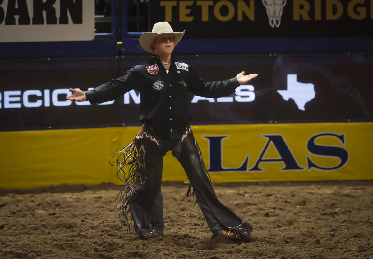 Dawson Hay reacts after competing in saddle bronc riding during the 8th go-round of the Nationa ...