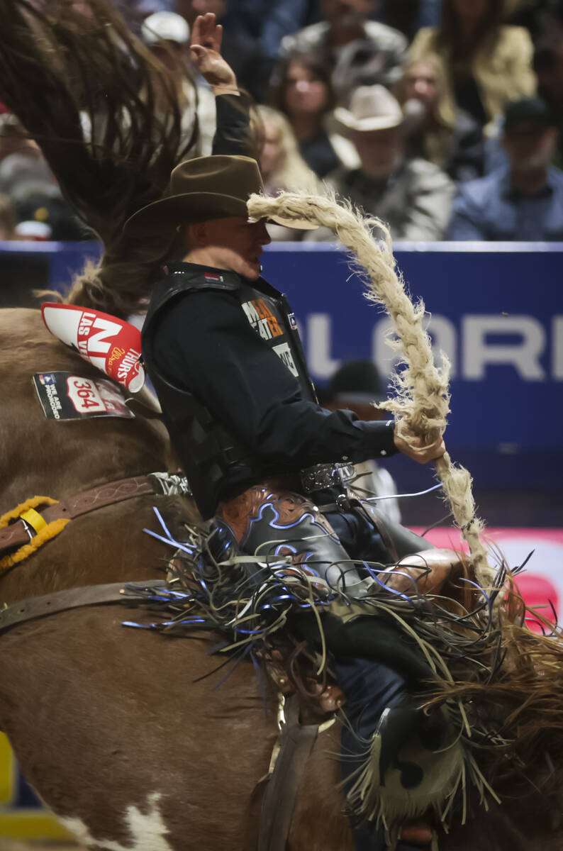 Zeke Thurston competes in saddle bronc riding during the 8th go-round of the National Finals Ro ...