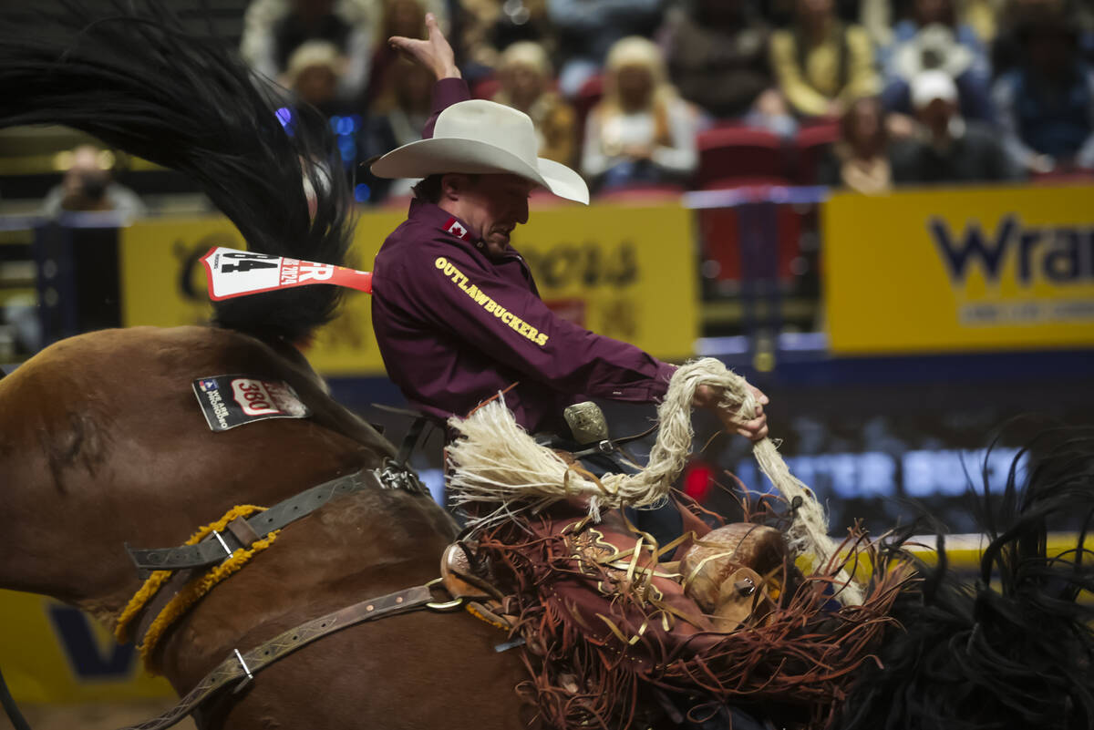 Ben Andersen competes in saddle bronc riding during the 8th go-round of the National Finals Rod ...