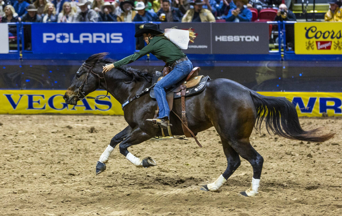 Barrel Racing contestant Kassie Mowry rides to a new event time record during National Finals R ...