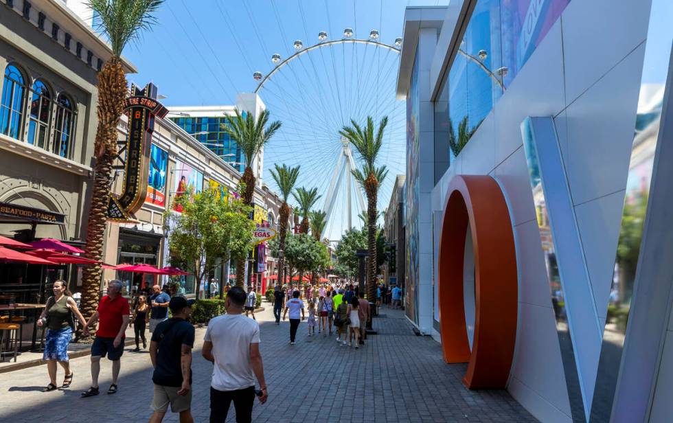 Visitors walk along The LINQ Promenade on Thursday, July 28, 2022, in Las Vegas. (L.E. Baskow/L ...