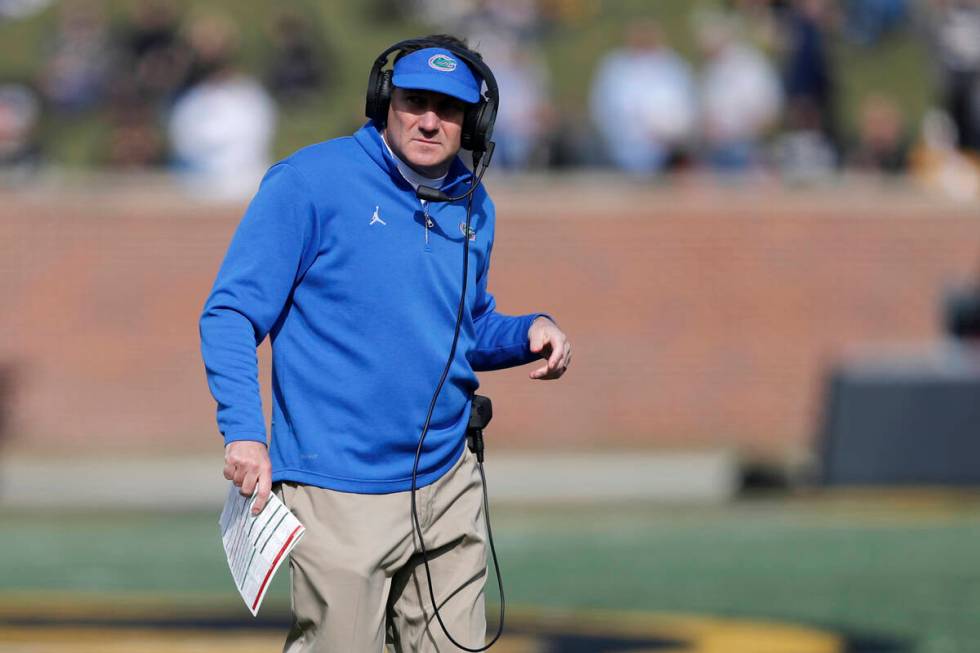 Florida head coach Dan Mullen watches from the sidelines during the first half of an NCAA colle ...