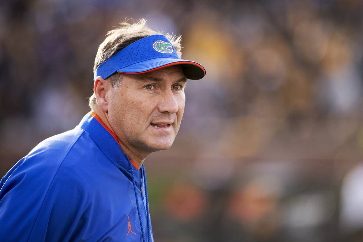 Florida coach Dan Mullen watches his team perform during the first quarter of an NCAA college f ...