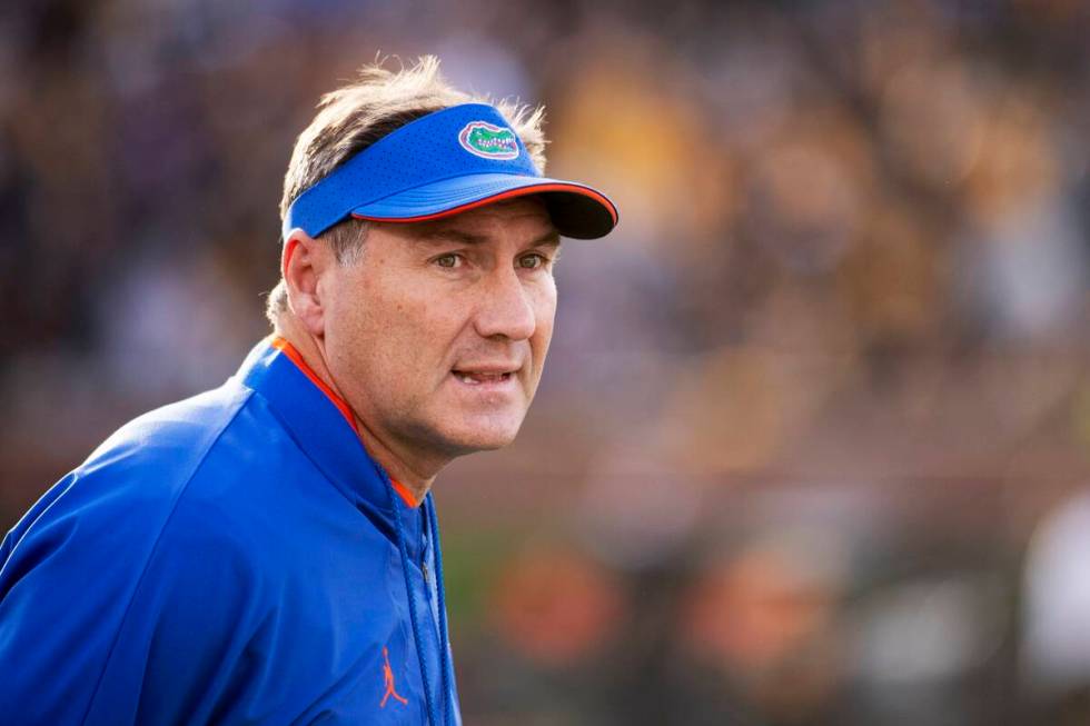 Florida coach Dan Mullen watches his team perform during the first quarter of an NCAA college f ...