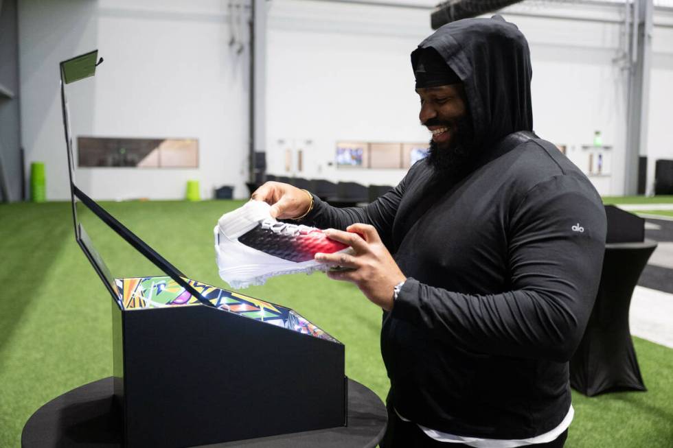 Raiders defensive tackle John Jenkins sees the cleats he will wear on "Monday Night Football" s ...