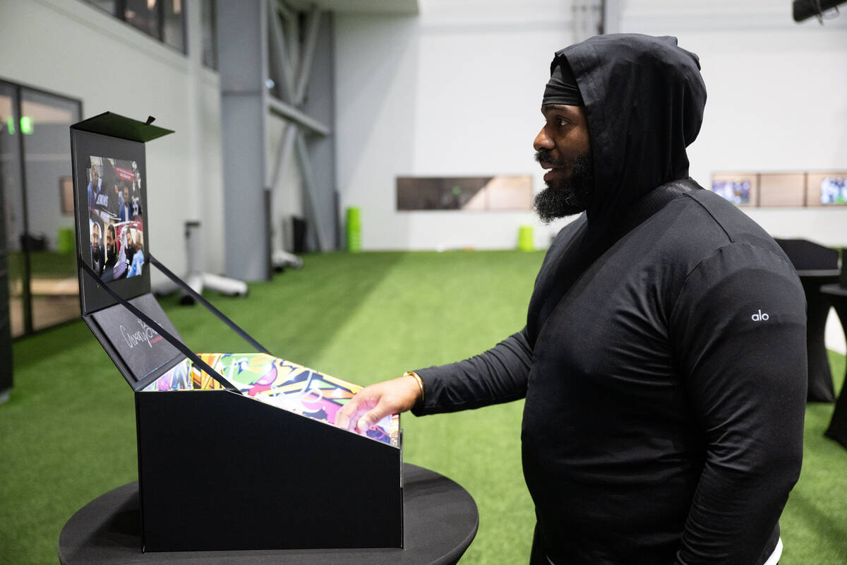 Raiders defensive tackle John Jenkins sees the cleats he will wear on "Monday Night Football" s ...