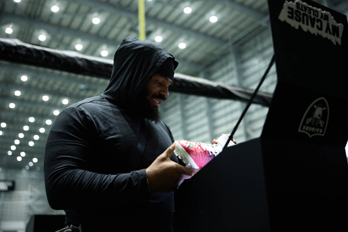 Raiders defensive tackle John Jenkins sees the cleats he will wear on "Monday Night Football" s ...