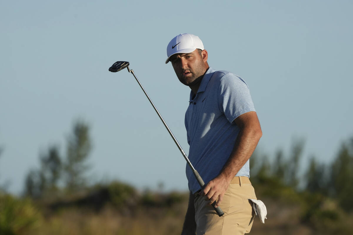 Scottie Scheffler, of the United States, watches his putt on the 17th green during the final ro ...