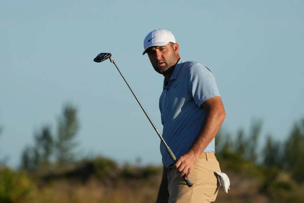 Scottie Scheffler, of the United States, watches his putt on the 17th green during the final ro ...