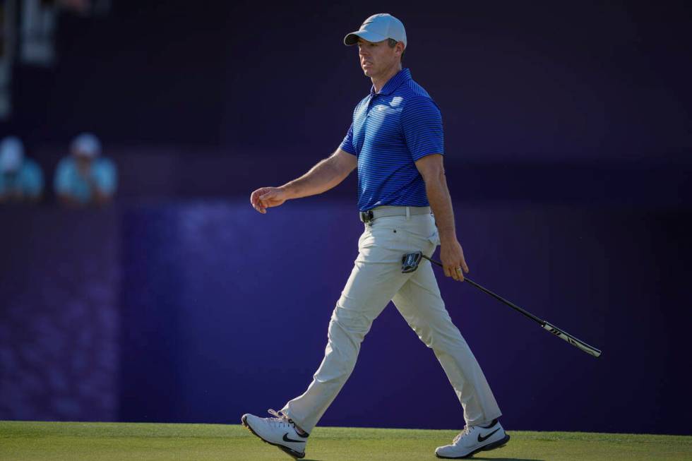 Rory McIlroy of Northern Ireland walks towards 17th green in the final round of World Tour Golf ...