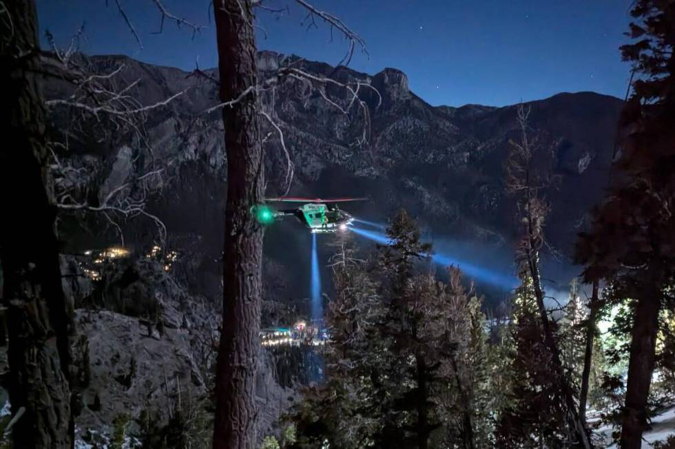 A Las Vegas Metropolitan Police Department helicopter takes part in a search and rescue operati ...