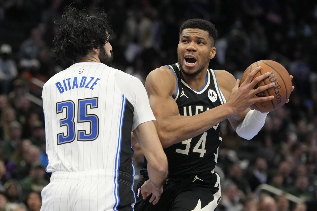 Milwaukee Bucks' Giannis Antetokounmpo tries to get past Orlando Magic's Goga Bitadze during th ...