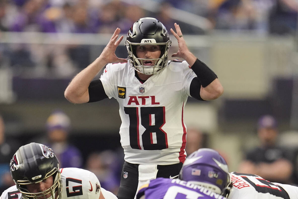 Atlanta Falcons quarterback Kirk Cousins (18) calls out plays during the first half of an NFL f ...