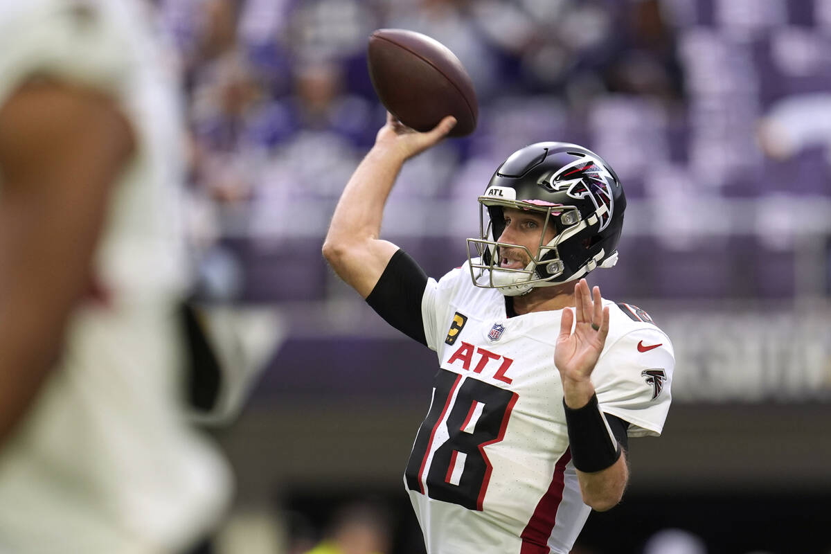 Atlanta Falcons quarterback Kirk Cousins warms up before an NFL football game against the Minne ...