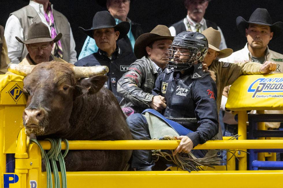 Tyler Bingham prepares to ride Hell Yeah Roscoe in the bull riding event during day nine of the ...