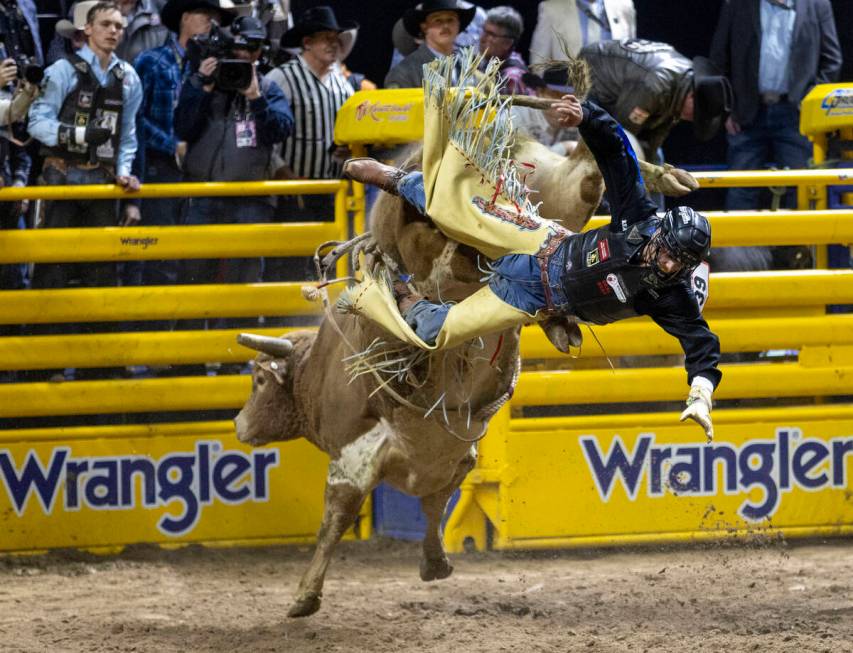 Chase Dougherty falls off of Pretty Boy in the bull riding event during day nine of the Nationa ...