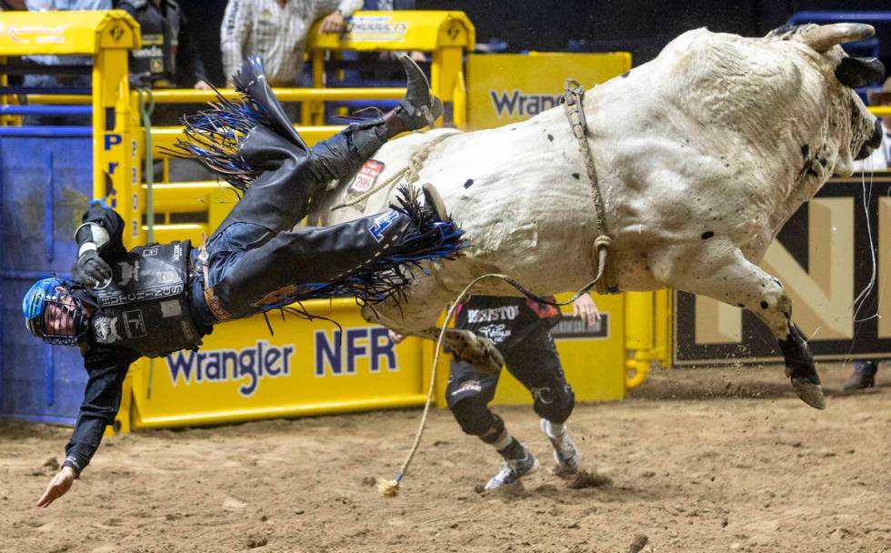 Tristen Hutchings falls off of James Bond in the bull riding event during day nine of the Natio ...