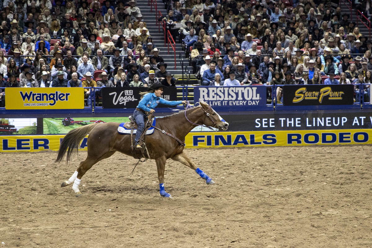 Shelley Morgan competes in the barrel racing event during day nine of the National Finals Rodeo ...