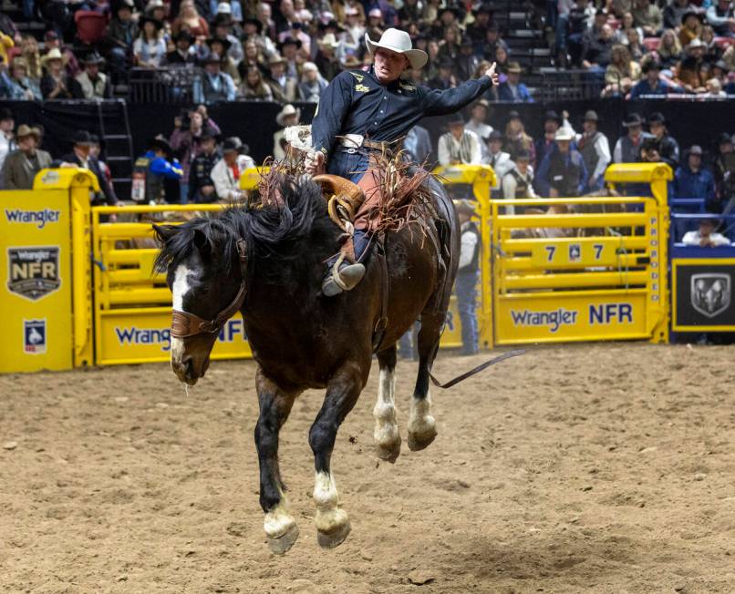 Ben Andersen competes in the saddle bronc riding event during day nine of the National Finals R ...